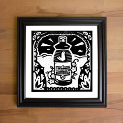 A black and white illustration of a bottle of Autocrat Coffee Syrup. The Bottle is nestled into an ornate folk art frame.
